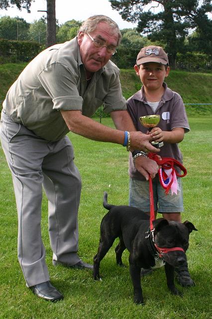 dogs9.jpg - Malcolm Butler presents the cup